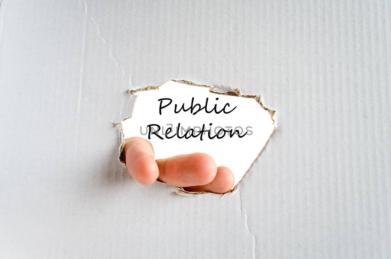 Hand and text on the cardboard background Public relation