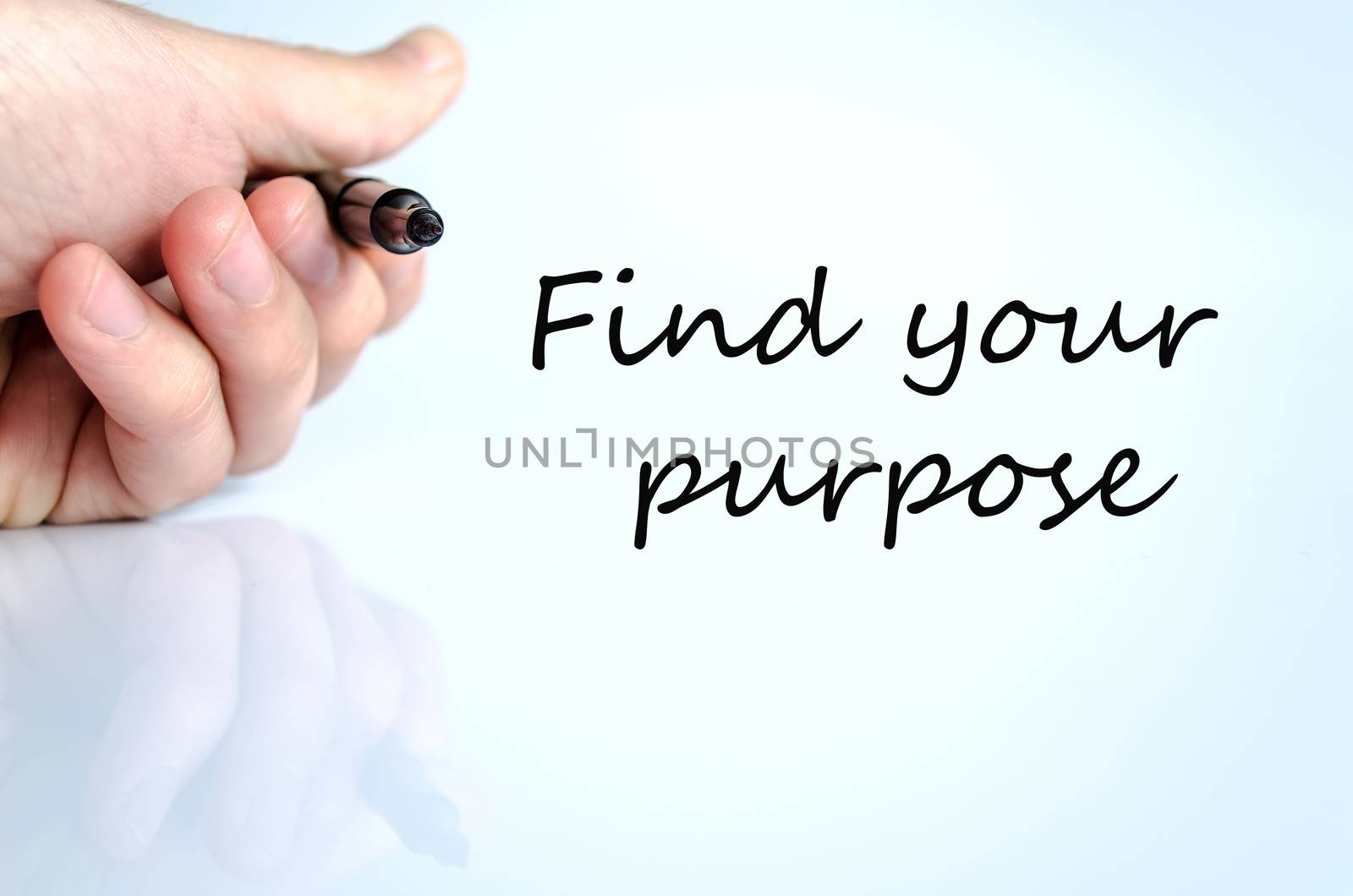 Pen in the hand isolated over white background Find your purpose concept
