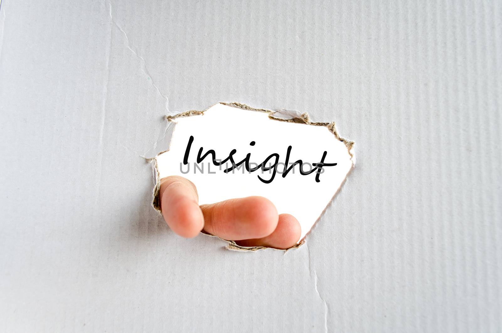 Hand and text on the cardboard background Insight Concept