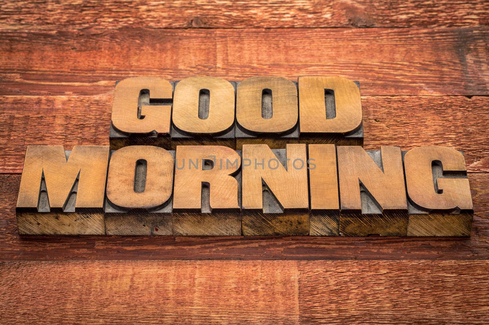 good morning typography - text in vintage letterpress wood type against rustic barn wood table