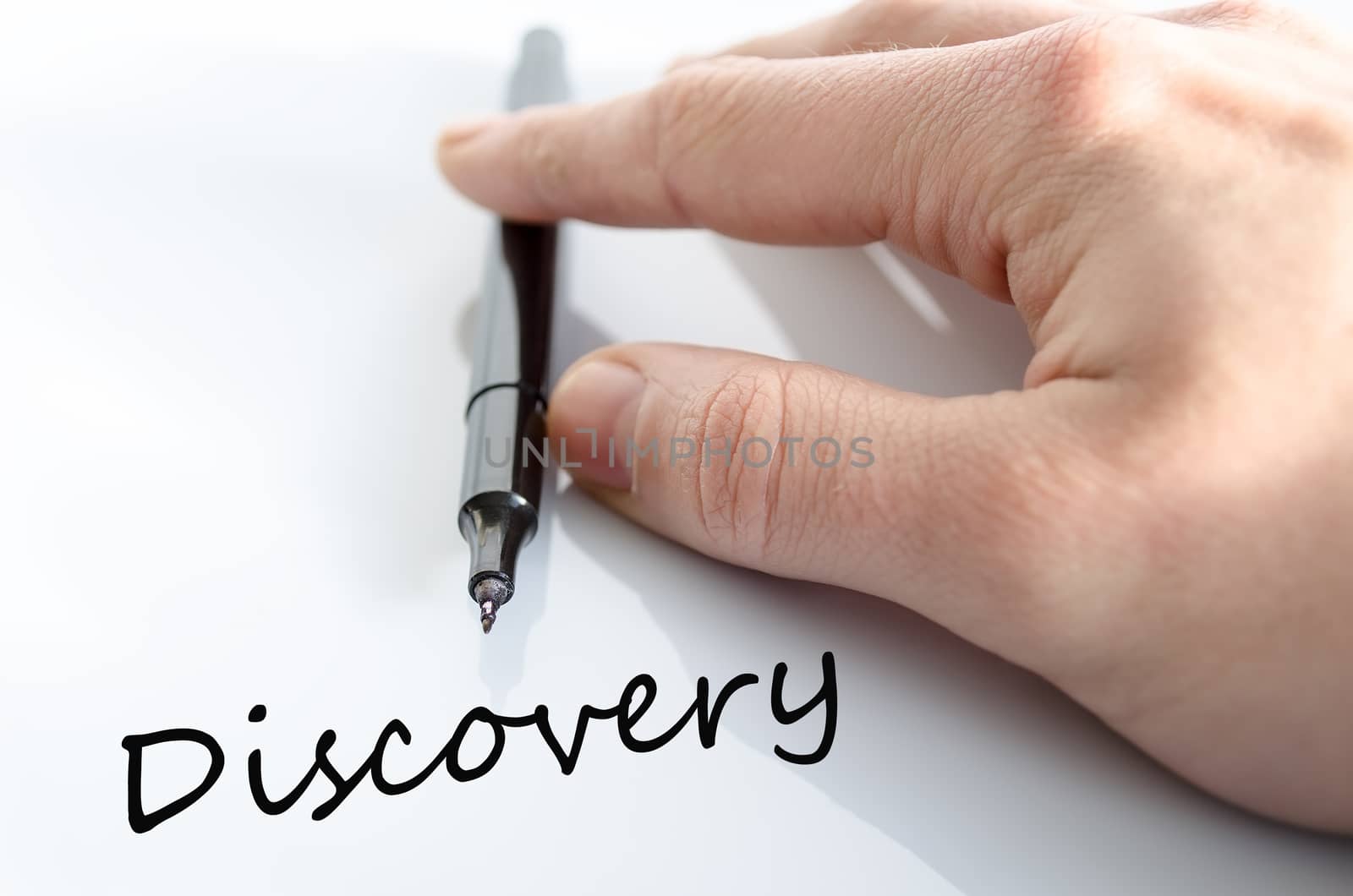 Pen in the hand isolated over white background Discovery Concept