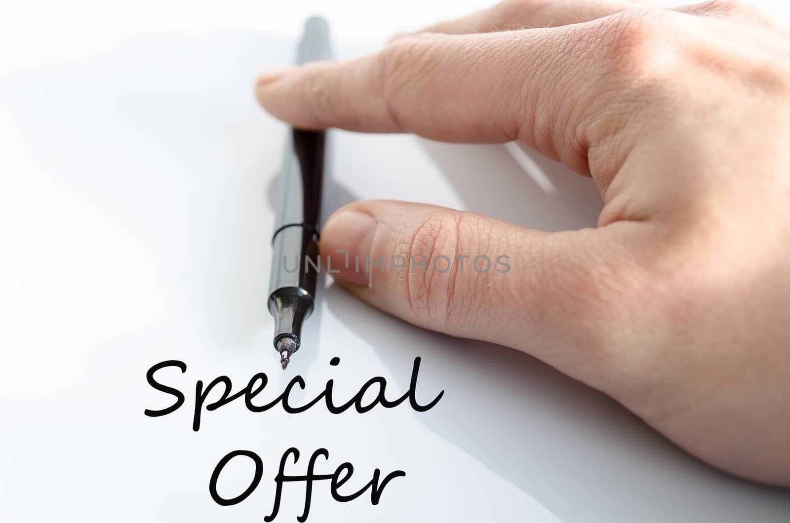 Pen in the hand isolated over white background Special Offer Concept
