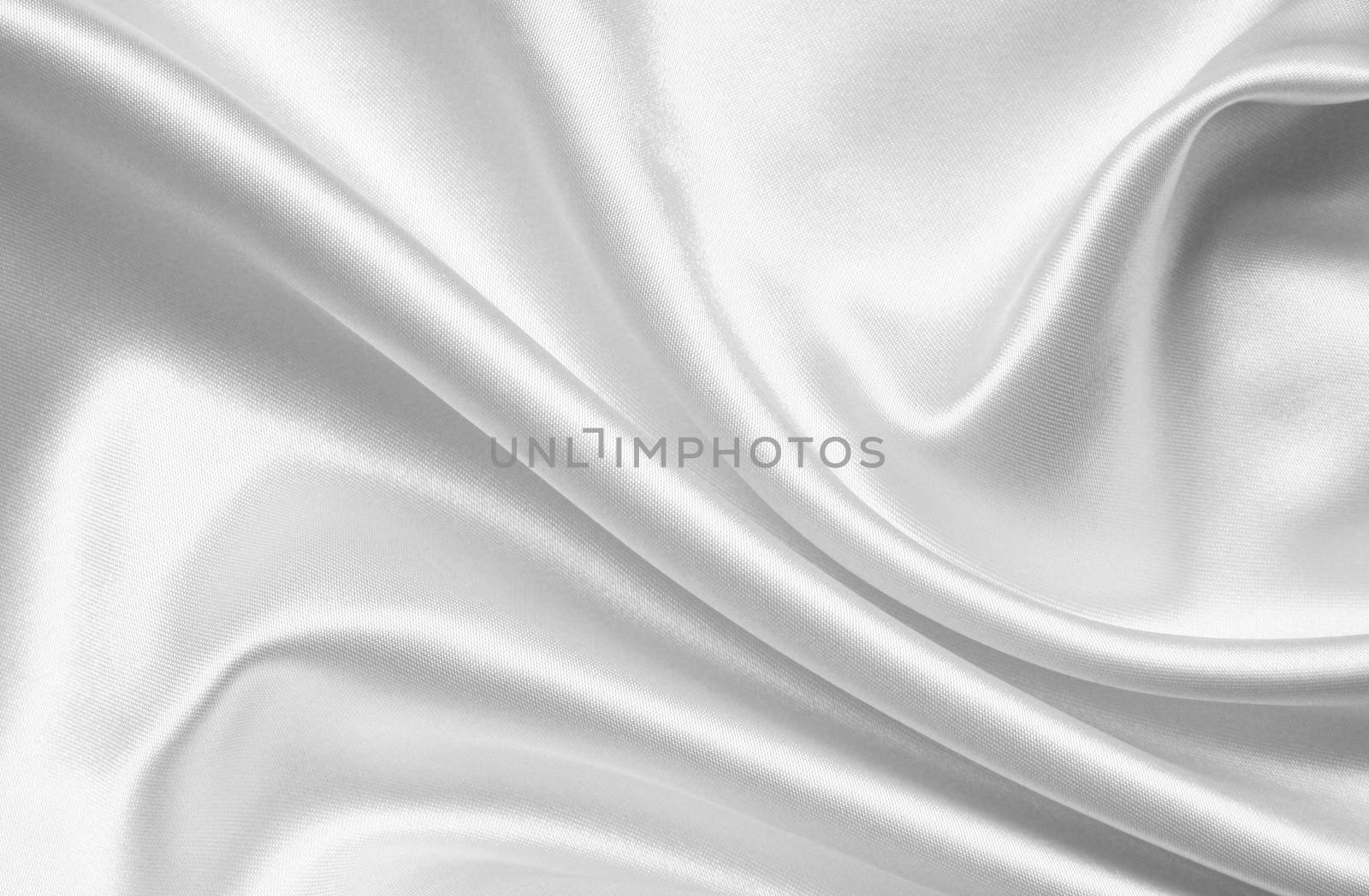 Smooth elegant white silk or satin can use as wedding background 