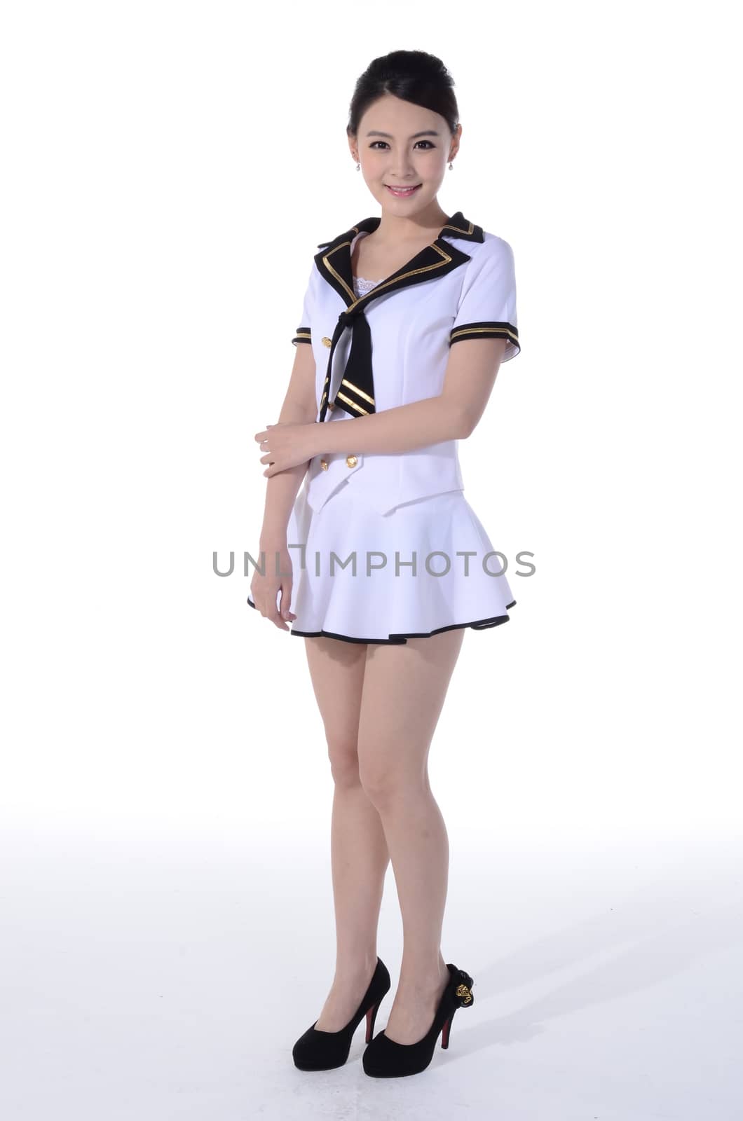 Active girl wear professional attire in front of a white background