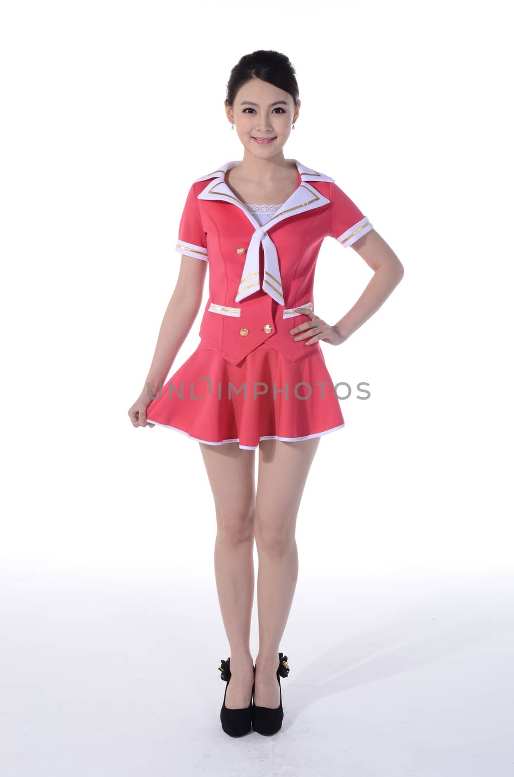 Active girl wear professional attire in front of a white background