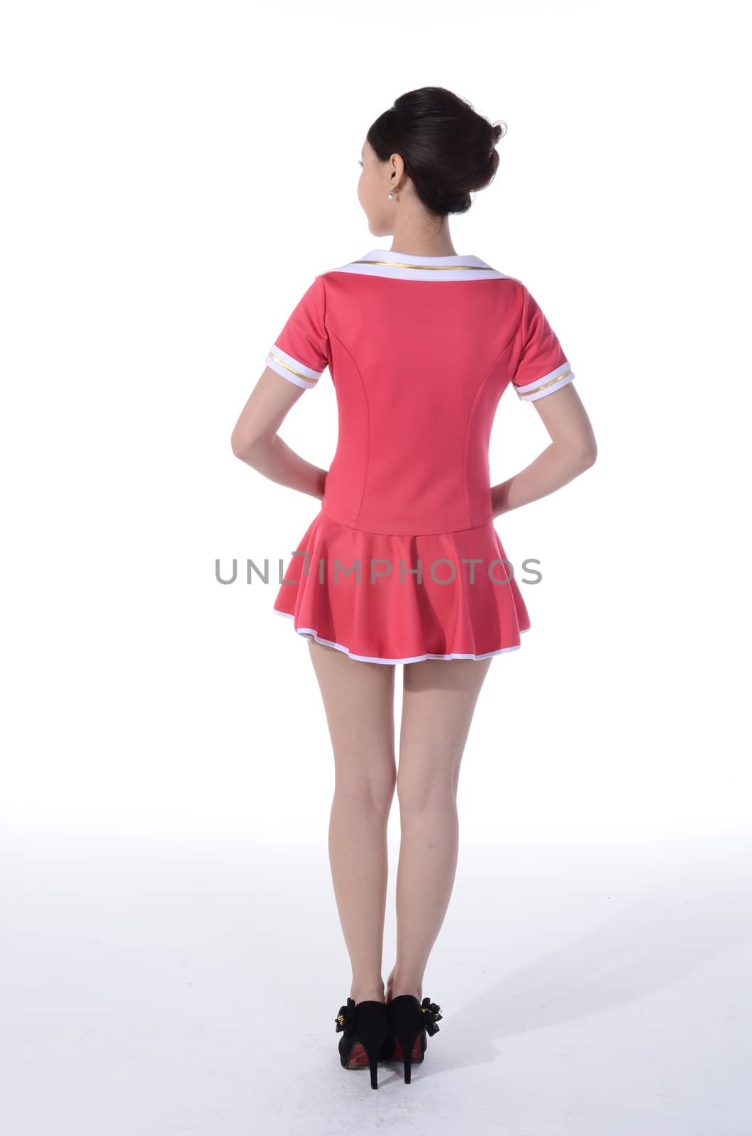 Active girl wear professional attire in front of a white background