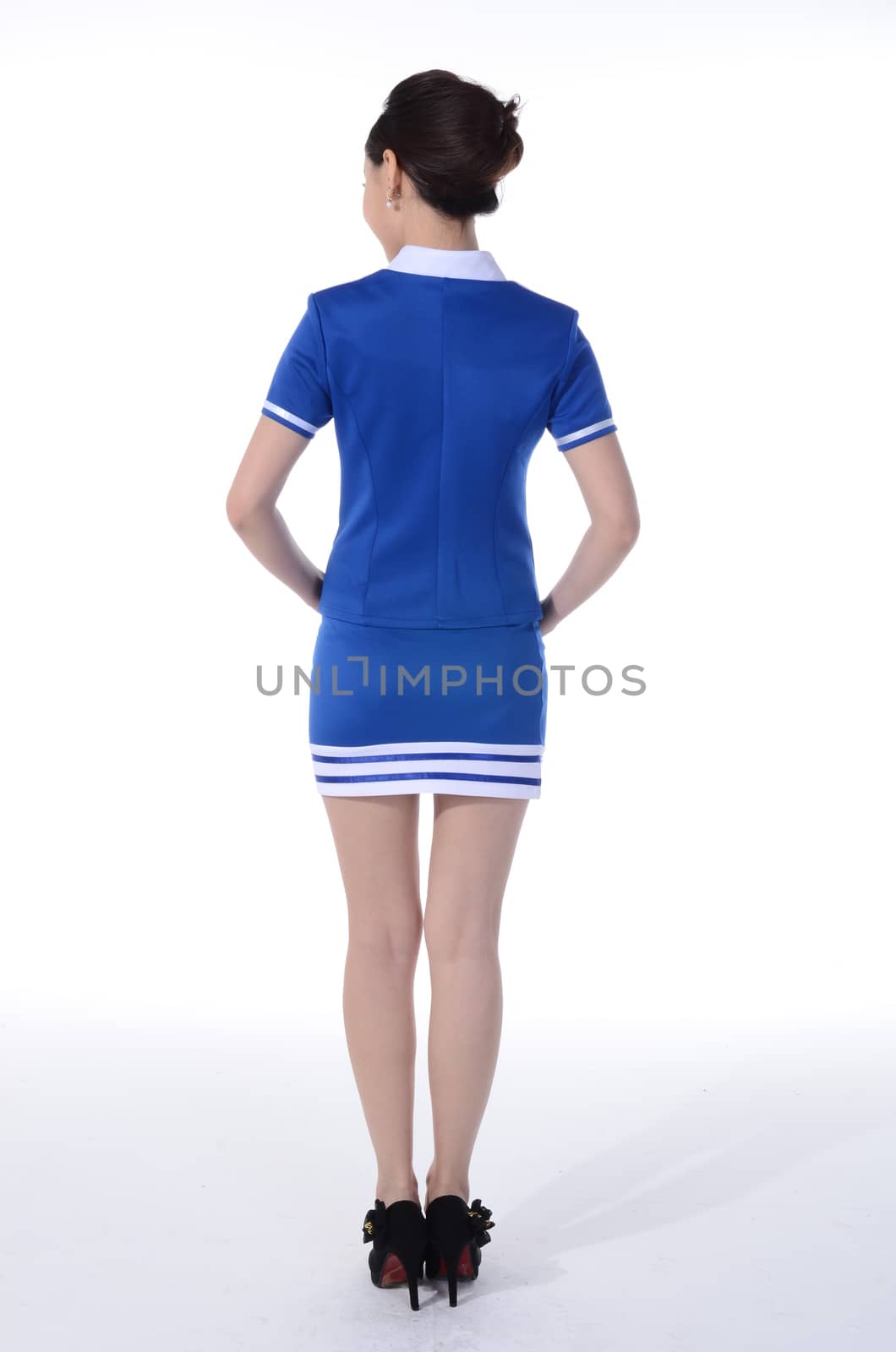 Active girl wear professional attire in front of a white background