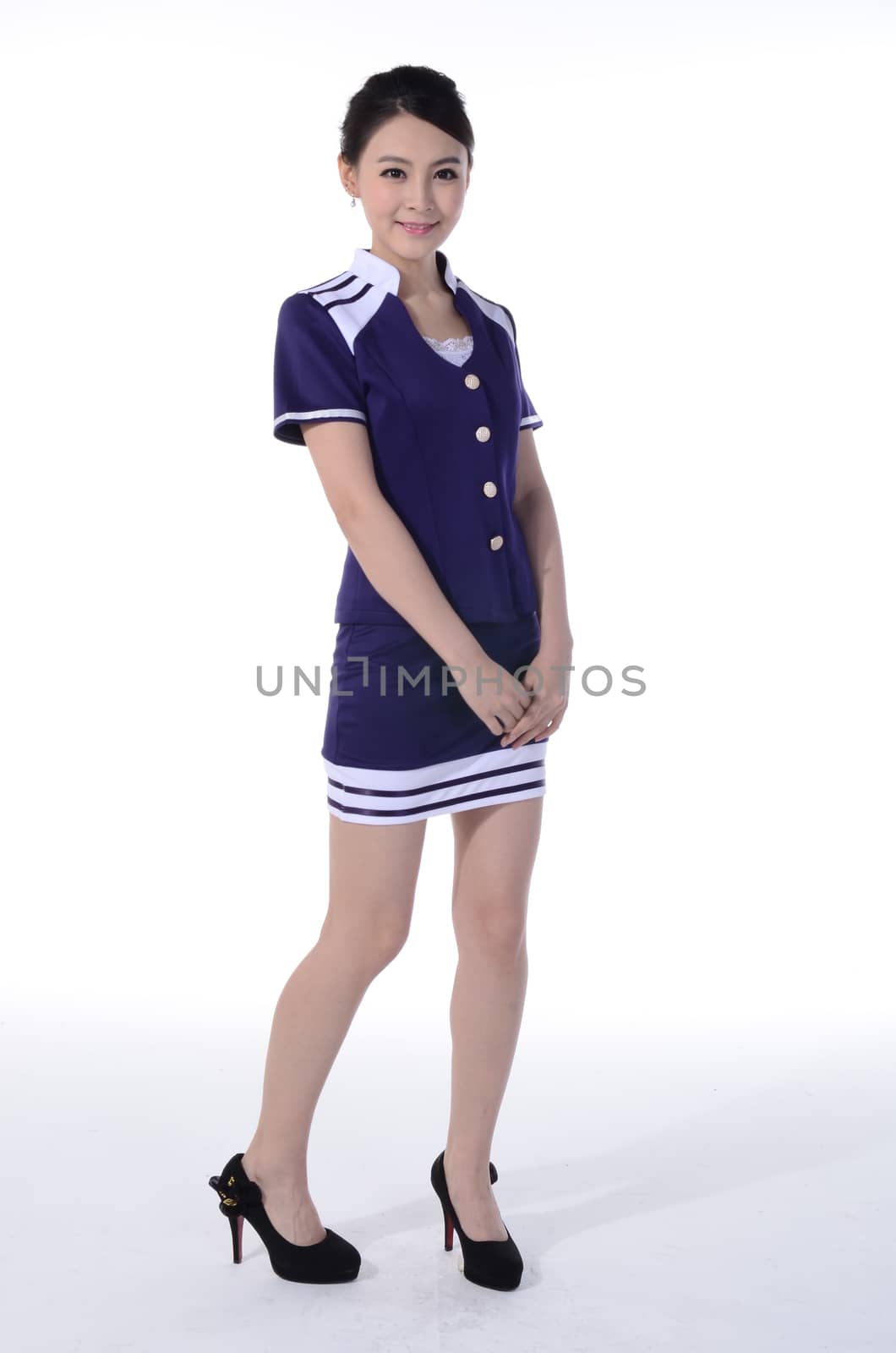 Active girl wear professional attire in front of a white background