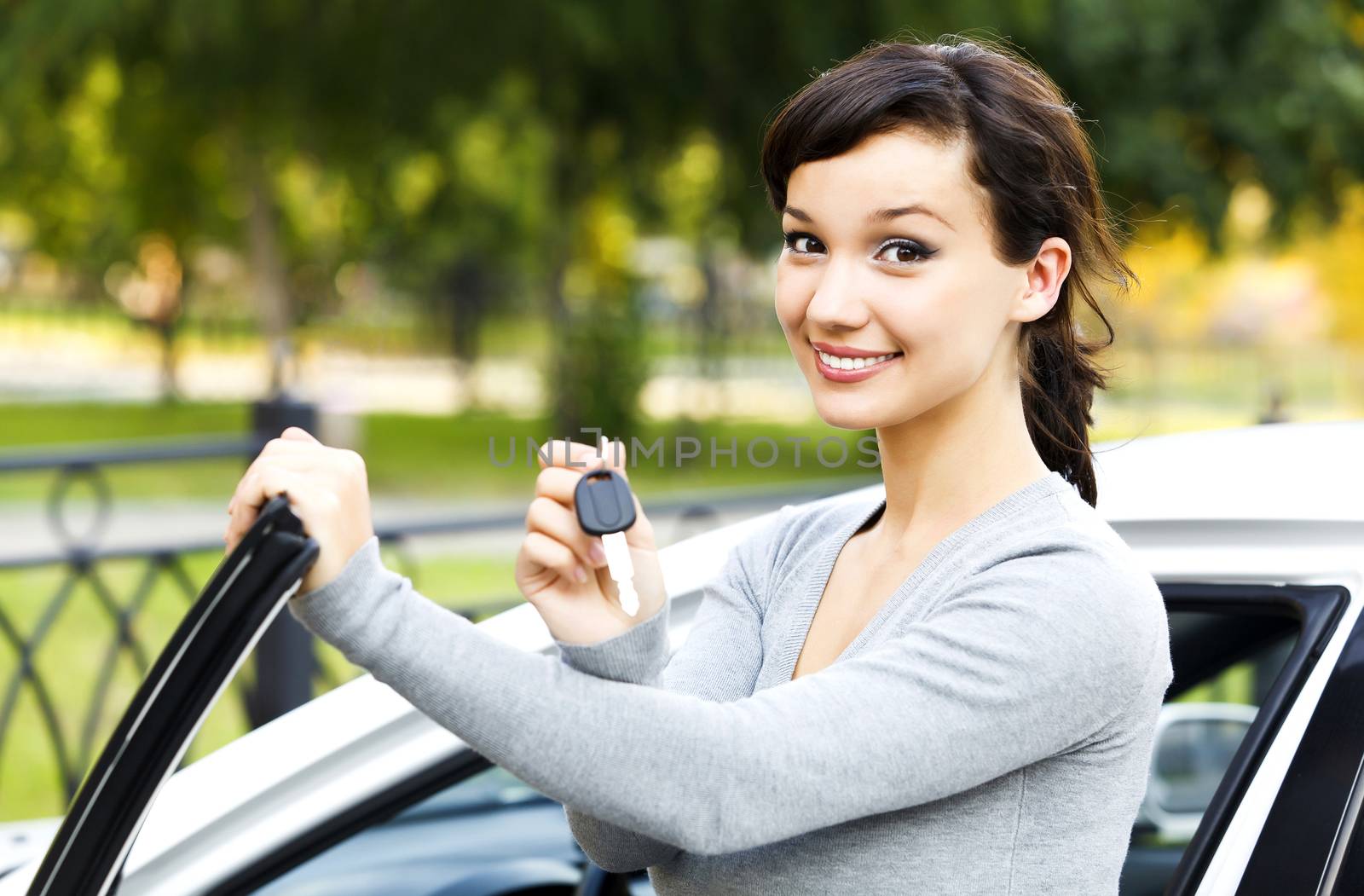 Pretty girl showing the car key by Nobilior