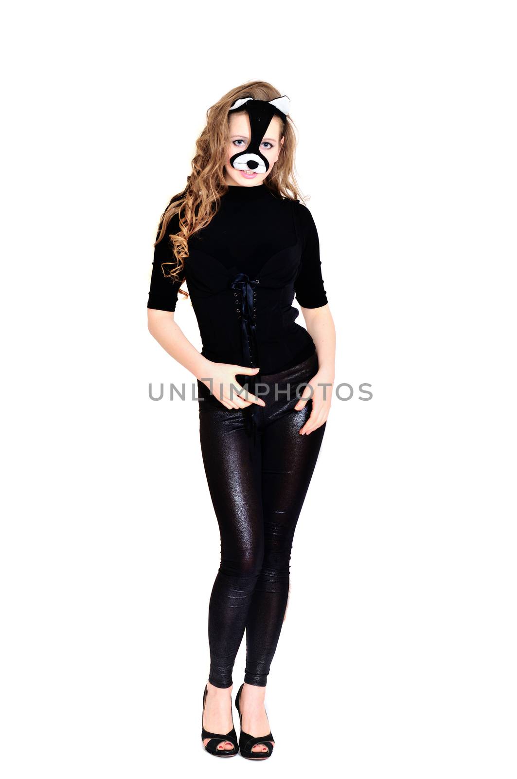cat-woman with long curly hair standing over the white