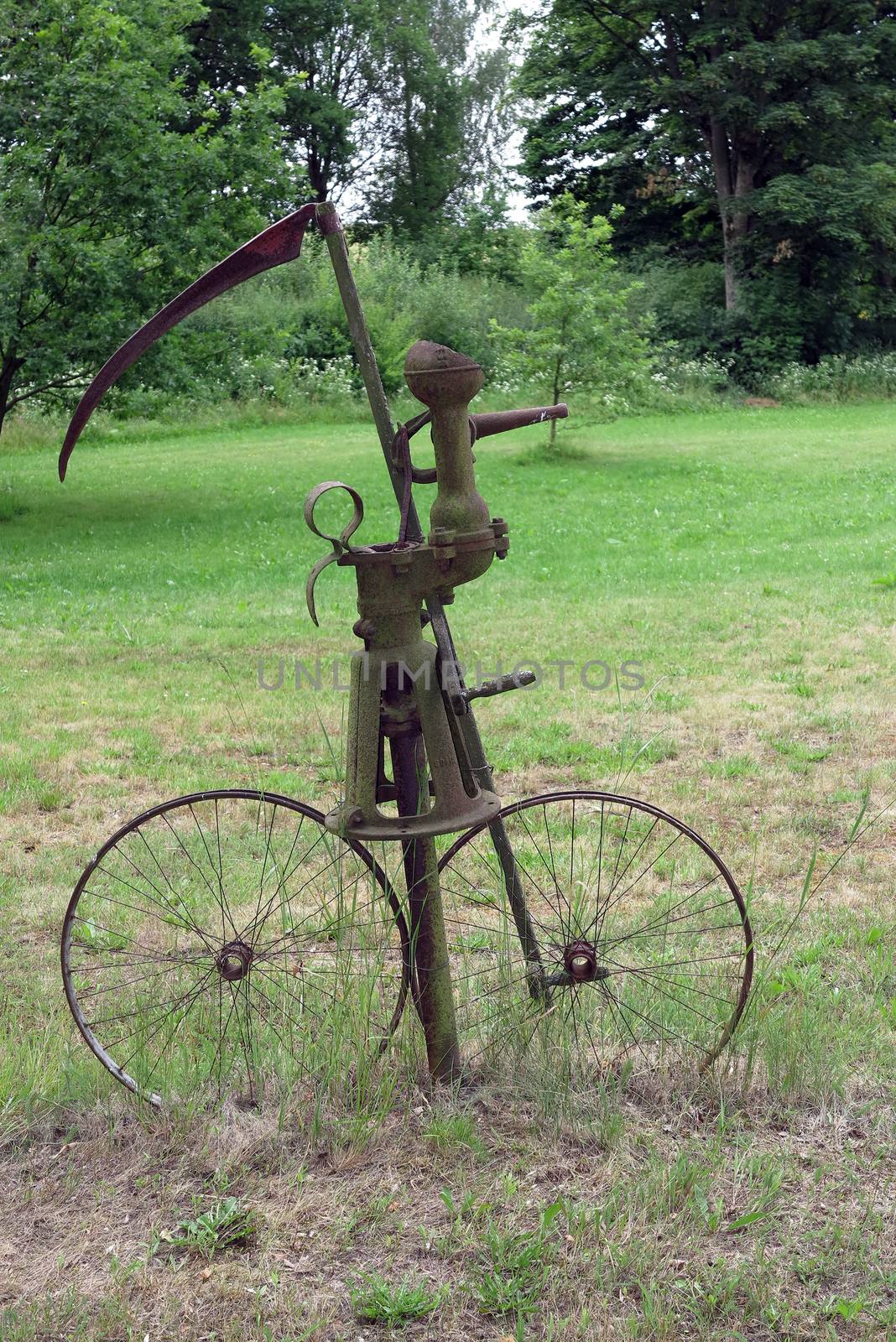 Bizarre creations in the village Sidlakov the Cheb region - scythe on a bicycle - Grim Reaper