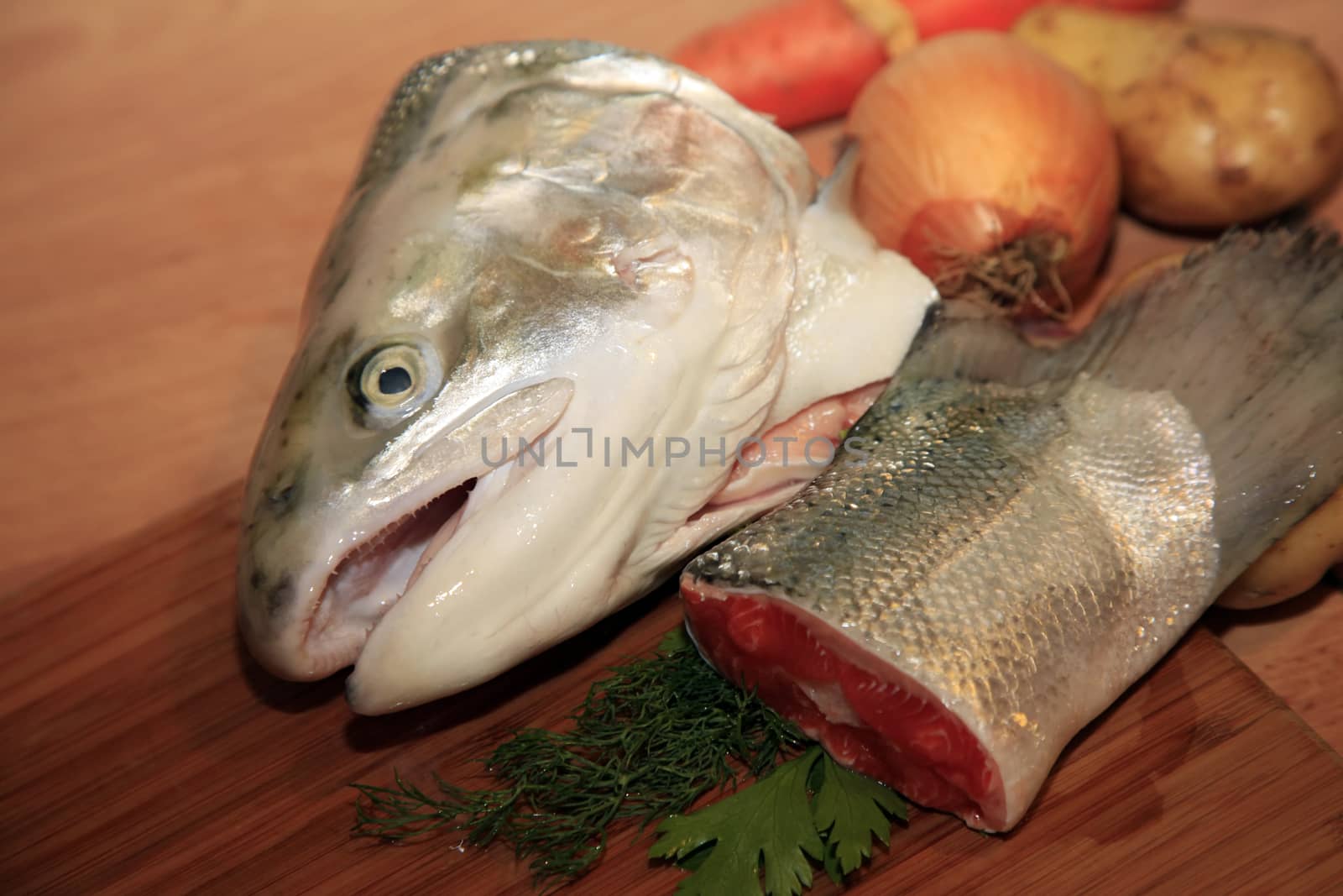 Fresh red salmon fish on wooden cooking desk