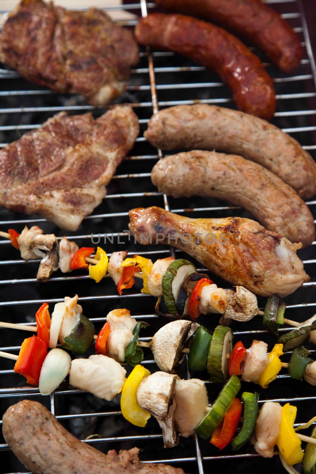 Grilling meat in flames, tasty dinner