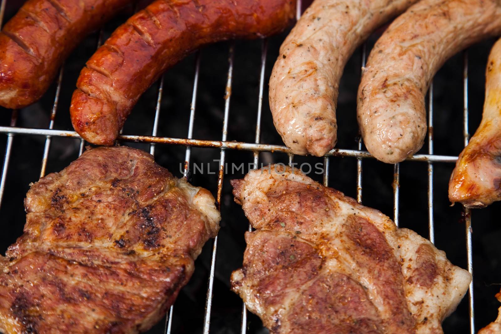Grilling meat in flames, tasty dinner