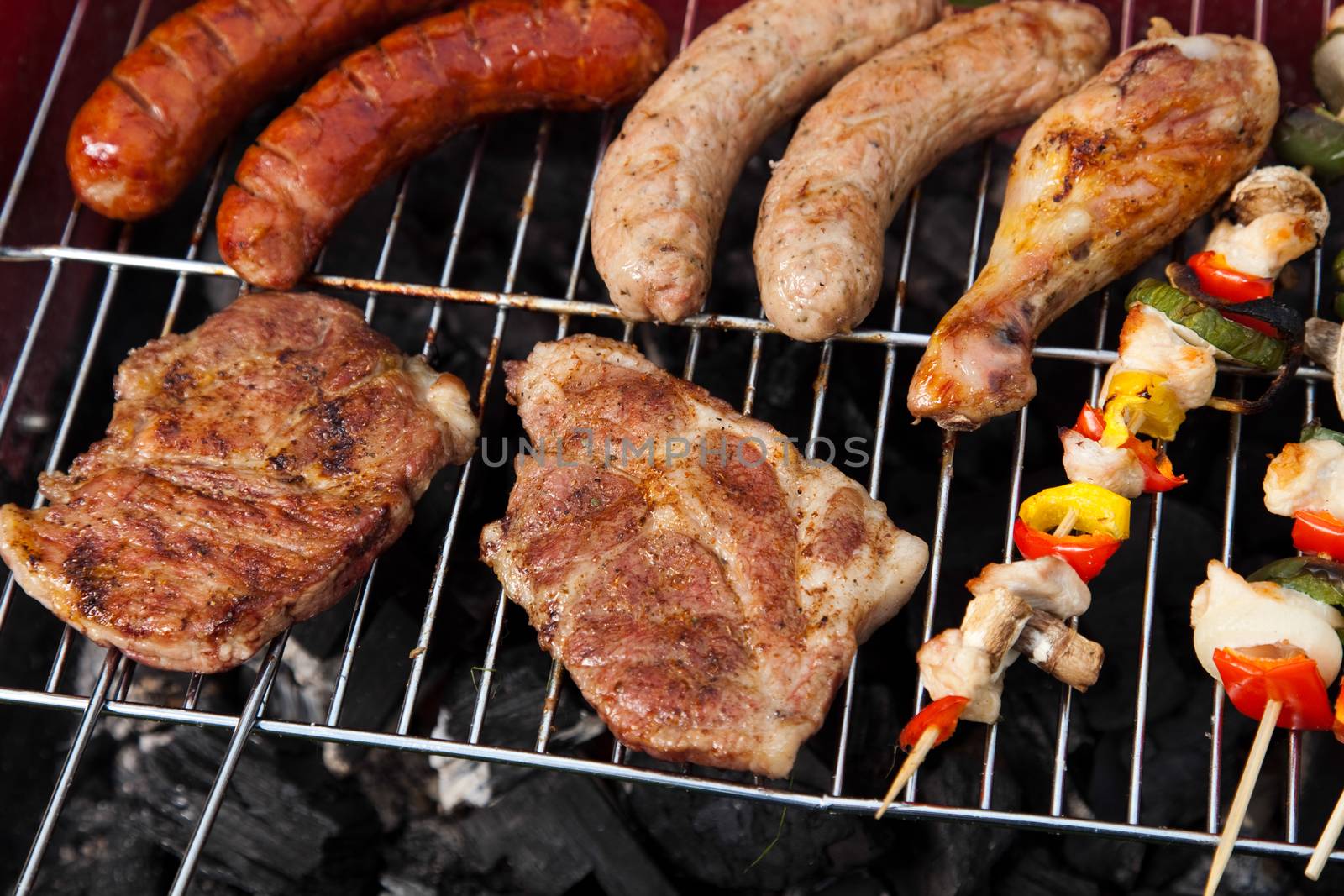 Grilling meat in flames, tasty dinner