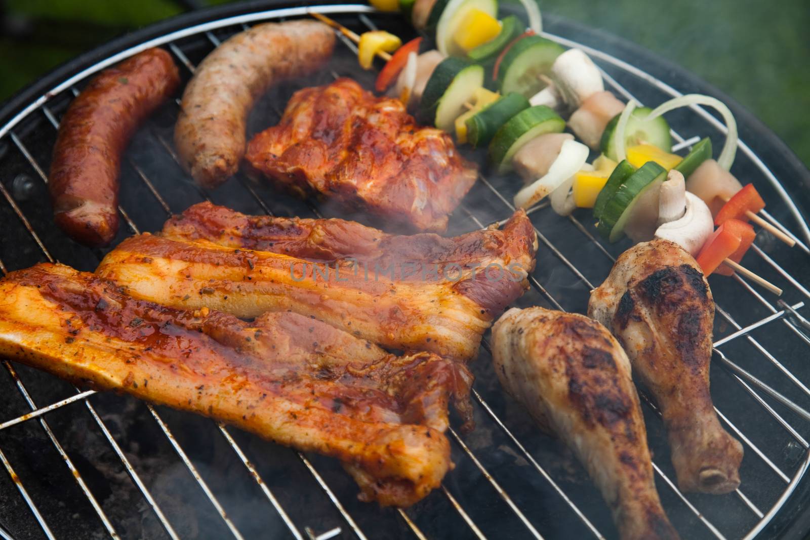 Grilling meat in flames, tasty dinner