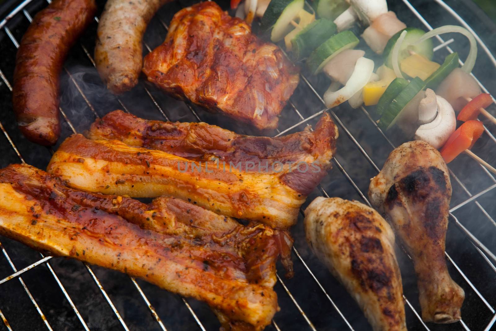 Grilling meat in flames, tasty dinner