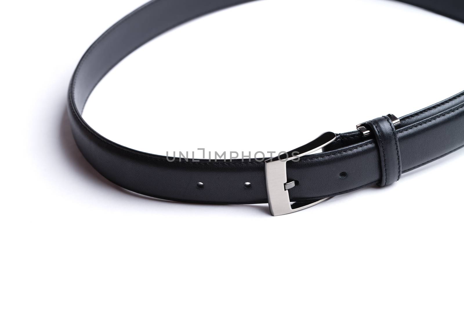 A black leather belt isolated on a white background.