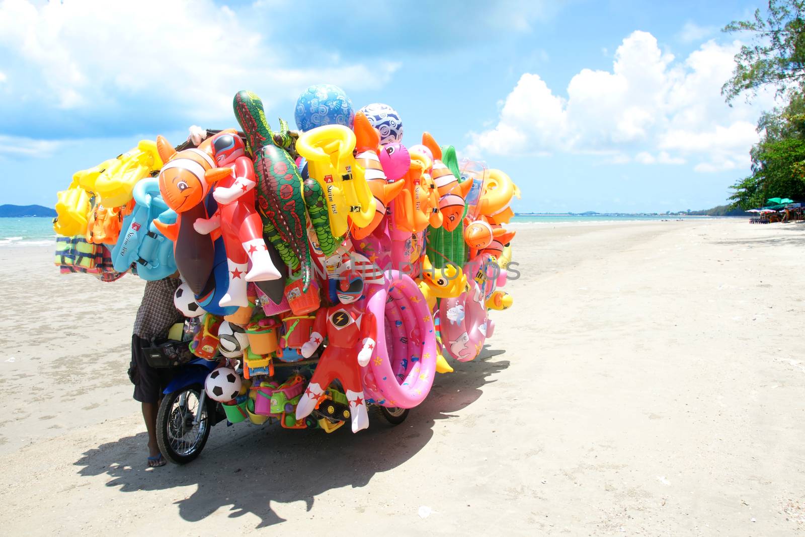 Toys shop and child on the beach in Eastern Thailand. by mranucha