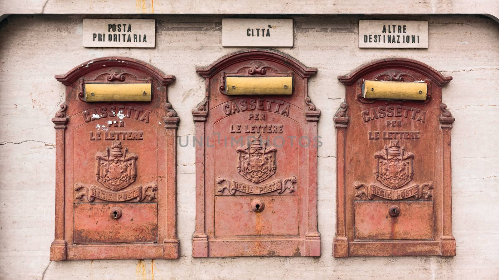 three antiques mailboxes in the city