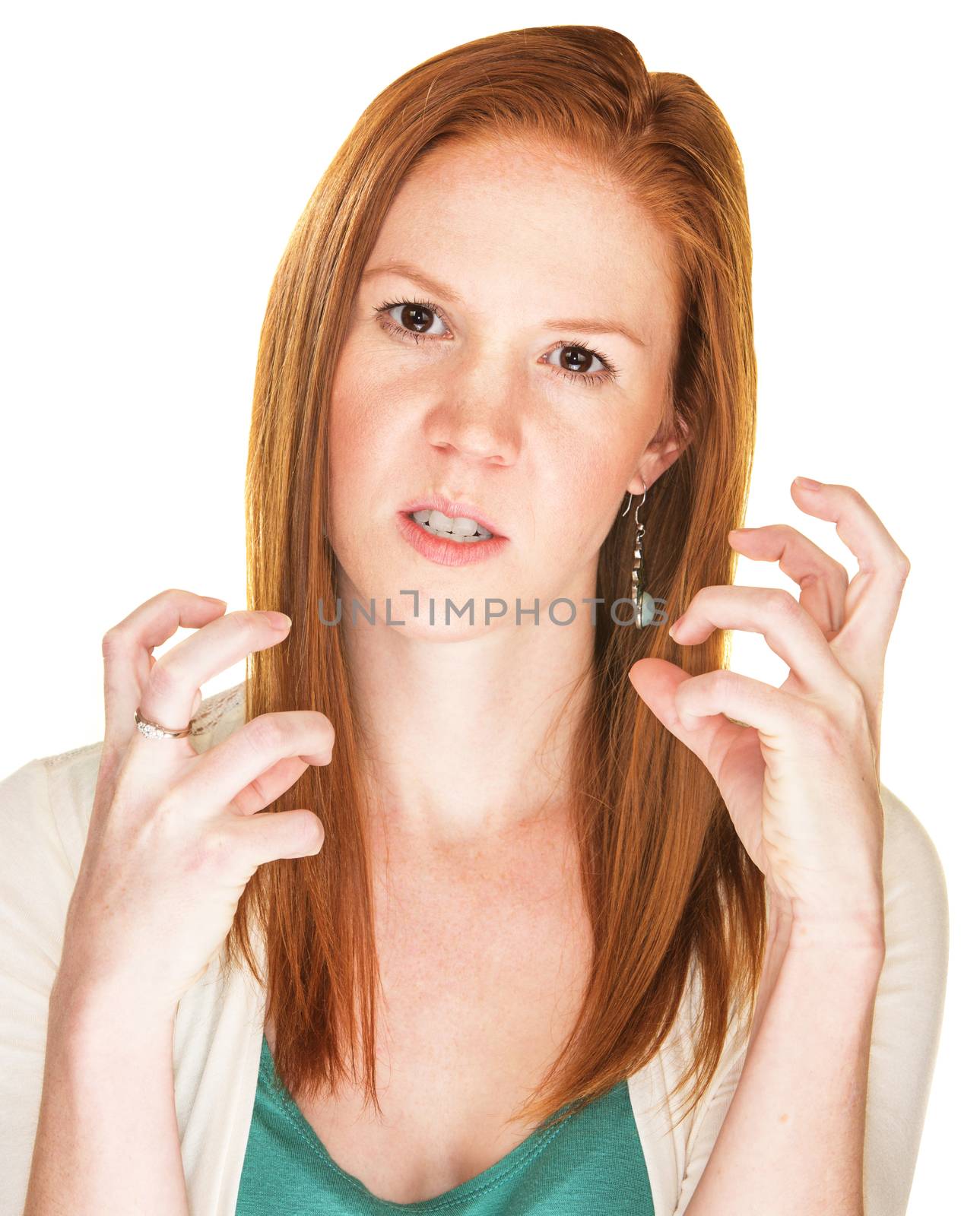 Isolated angry Caucasian female with curled fingers
