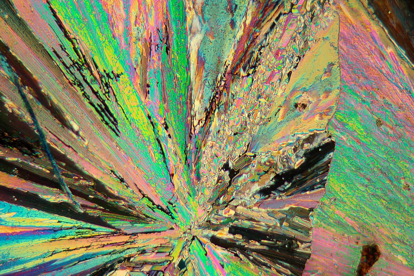Thulium is a rare earth element. The crystals are precipitated from a solution on a microscope slide and photographed in polarized light.