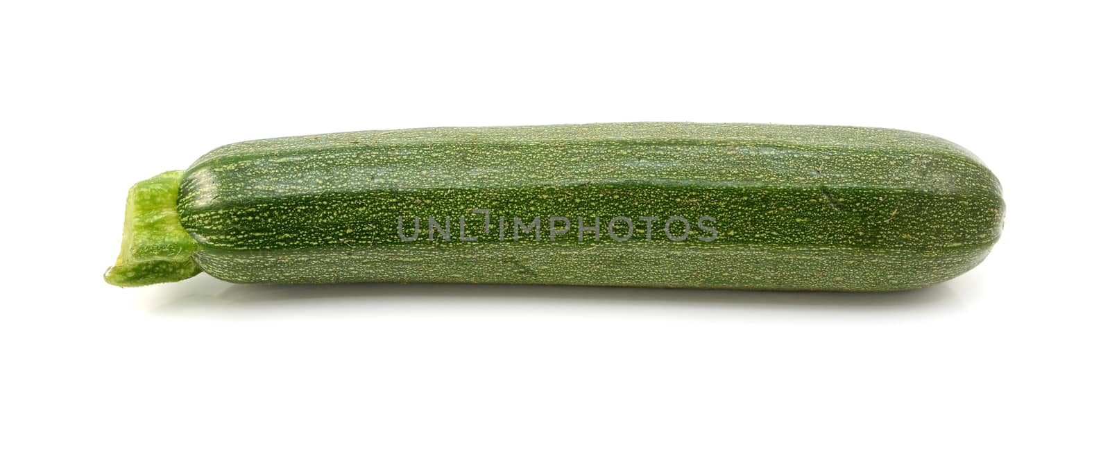 Small green courgette or zucchini, isolated on a white background