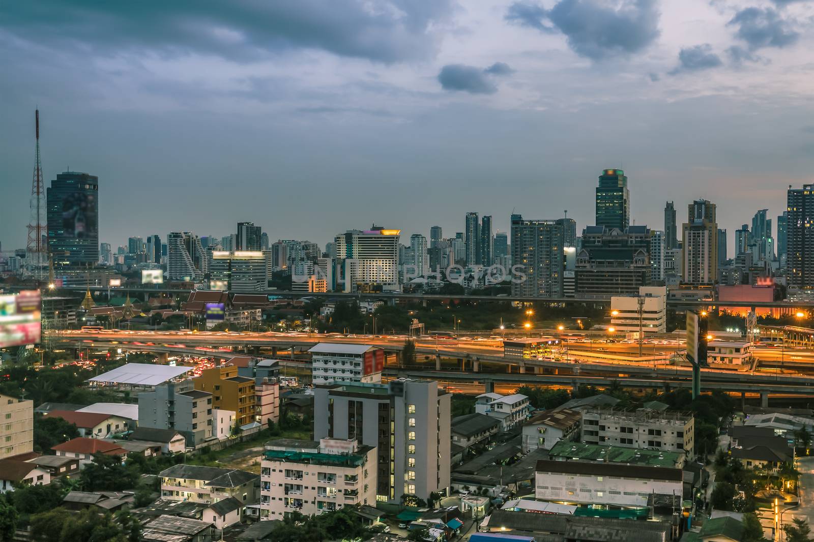 Business Building Bangkok city area at night life with transportation way, logistic concept high angle bird eyes view by FrameAngel