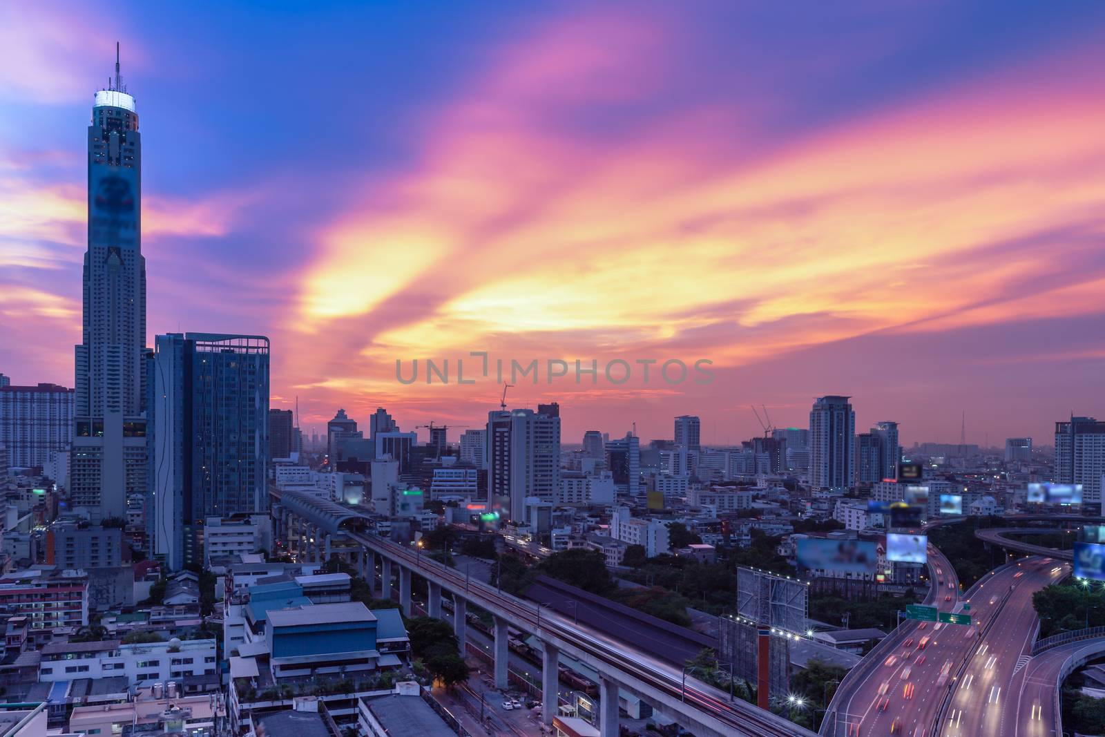 Business Building Bangkok city area at night life with transport by FrameAngel