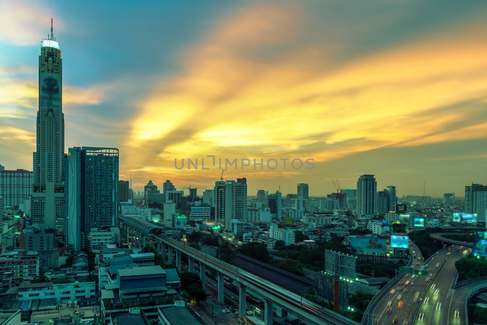 Business Building Bangkok city area at night life with transportation way, logistic concept high angle bird eyes view