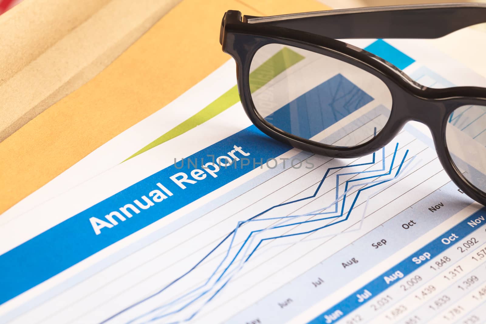 Annual Report letter document and eyeglass  by FrameAngel