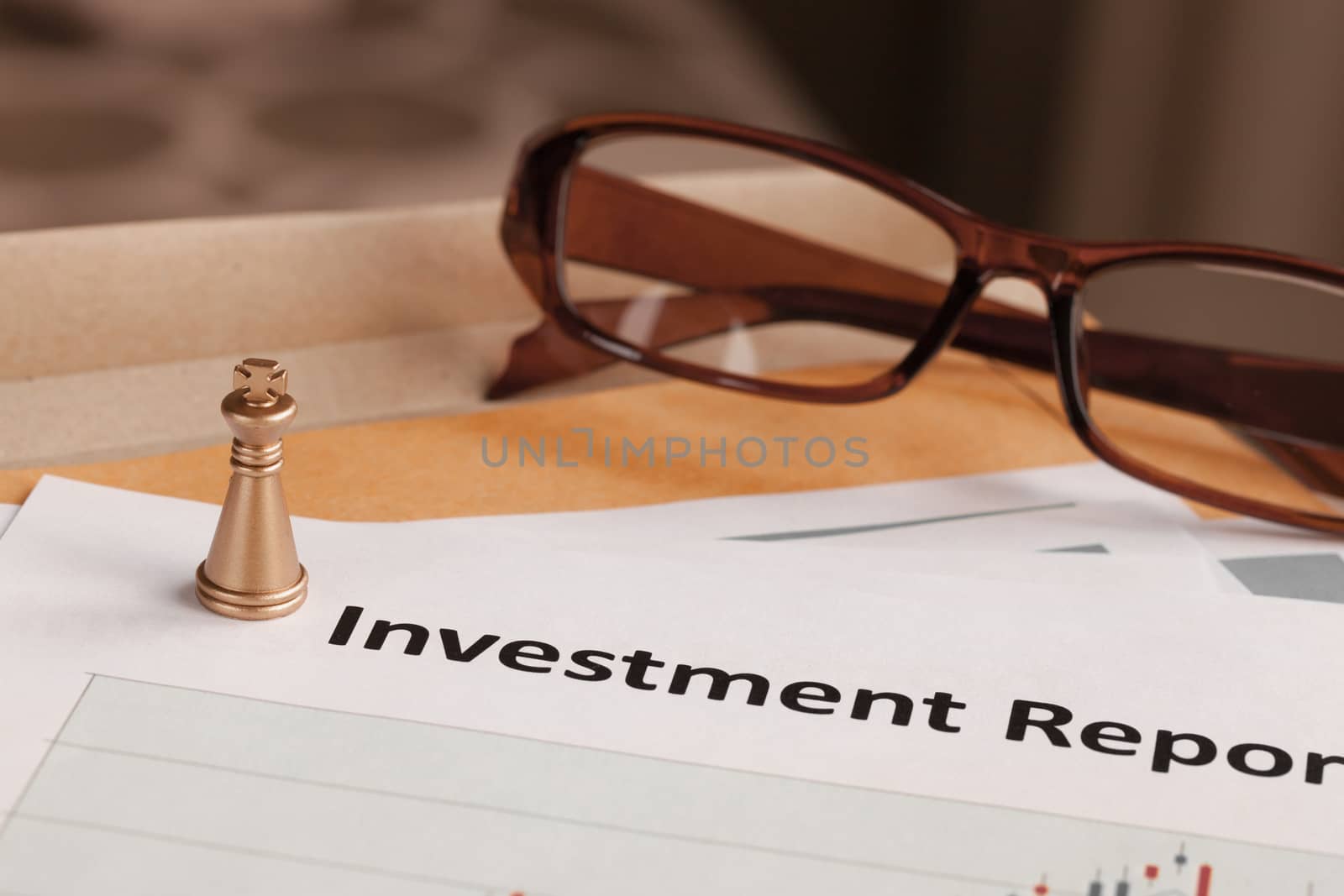 Investment Report letter document and eyeglass; document is mock by FrameAngel