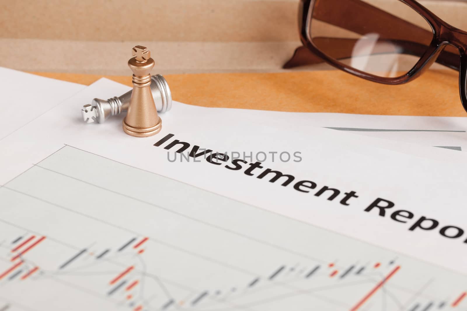 Investment Report letter document and eyeglass; document is mock by FrameAngel