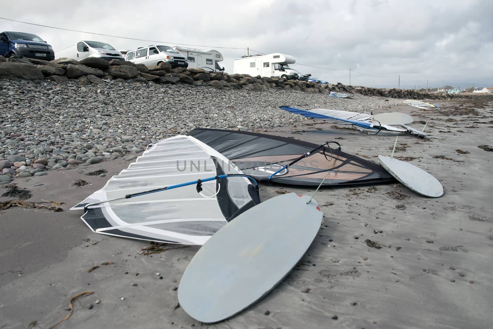 wind surfers vans parked on the wild atlantic way in Ireland by morrbyte