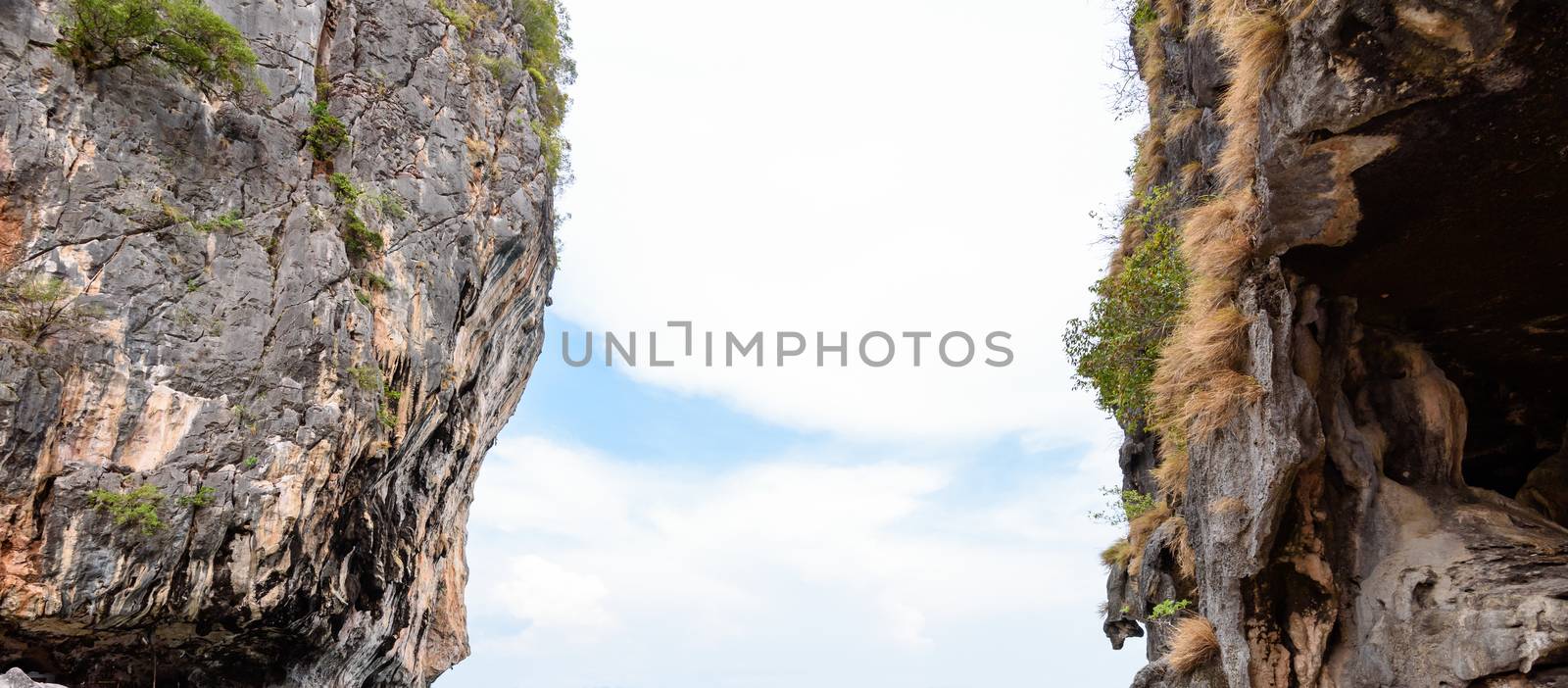 Two stone cliff with a space middle and see the sky