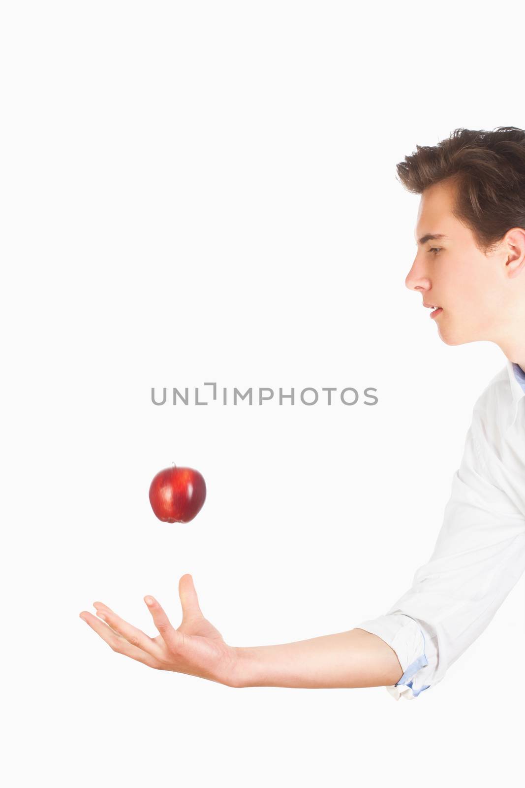 Man Tossing Red Apple in the Air by courtyardpix