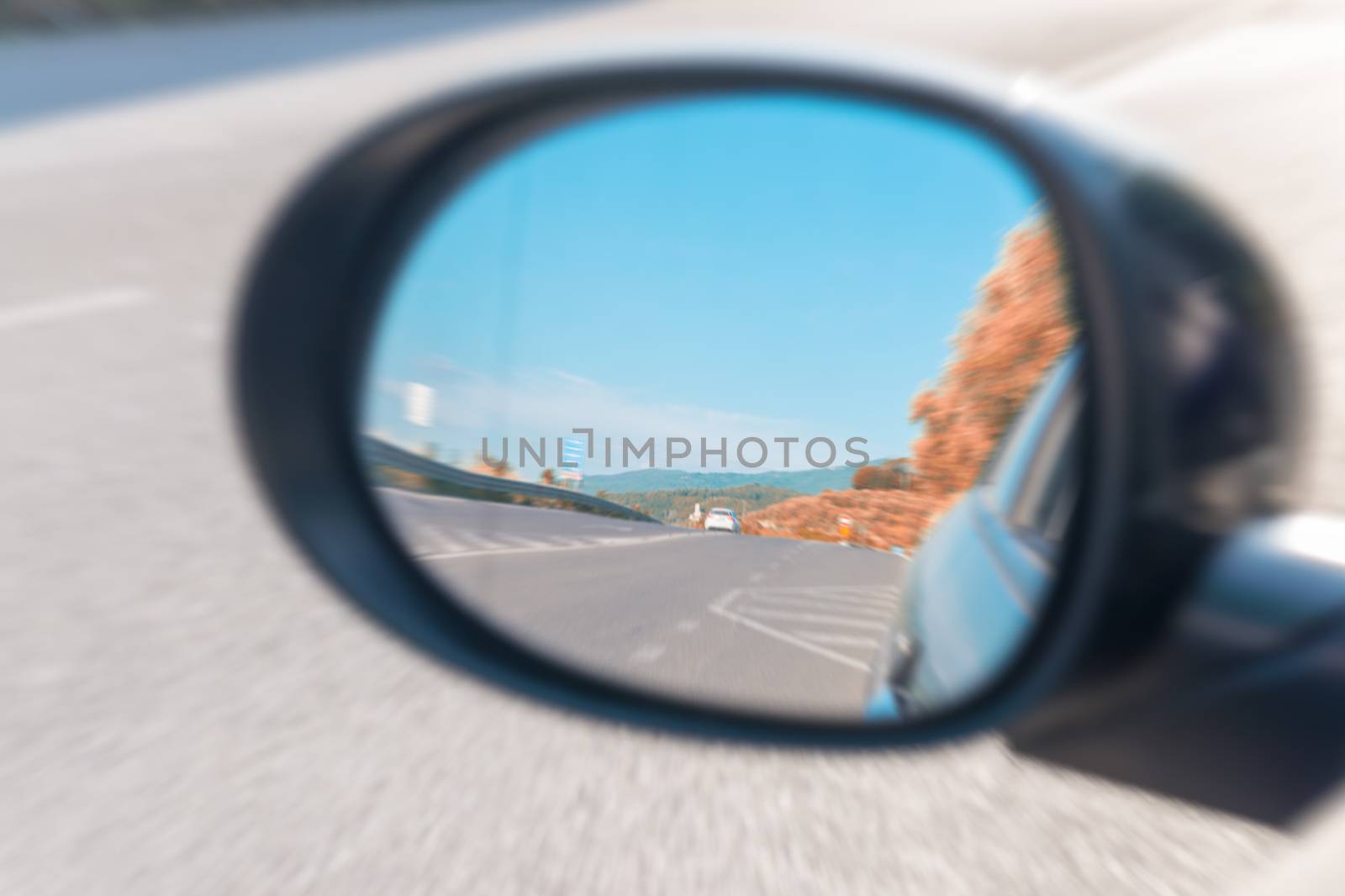 Colors of Tuscany countryside as seen from car mirror by jovannig