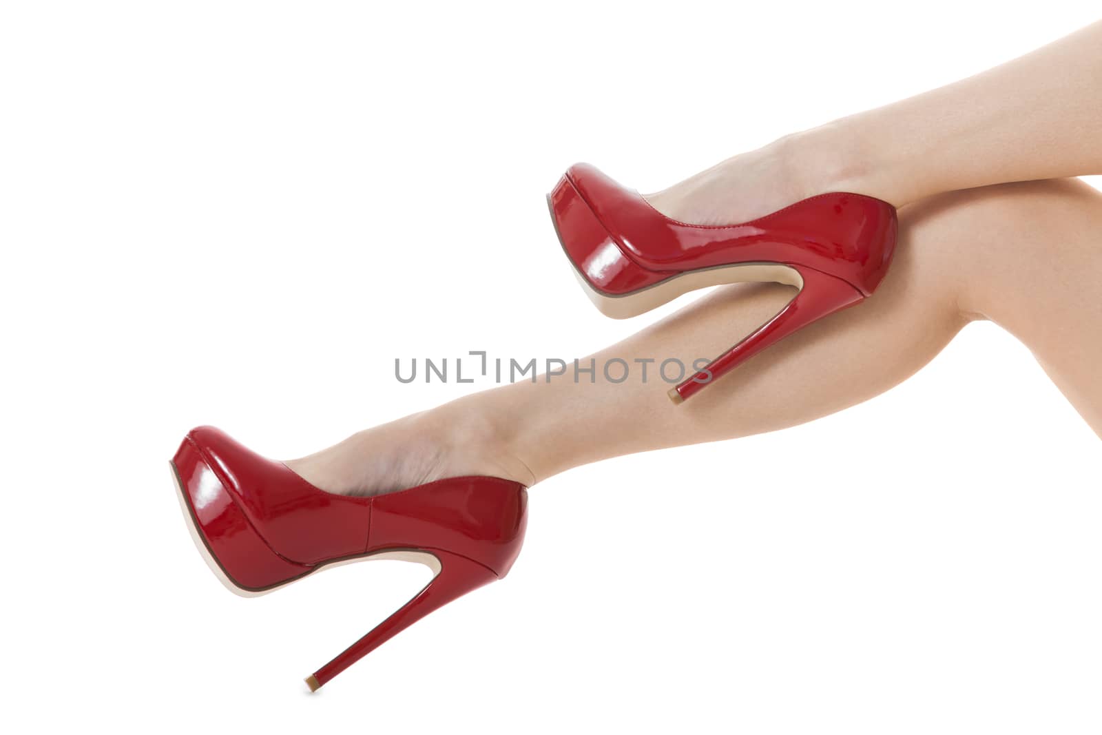 Flawless Woman Legs in Elegant Red High Heel Shoes, Isolated on White Background.