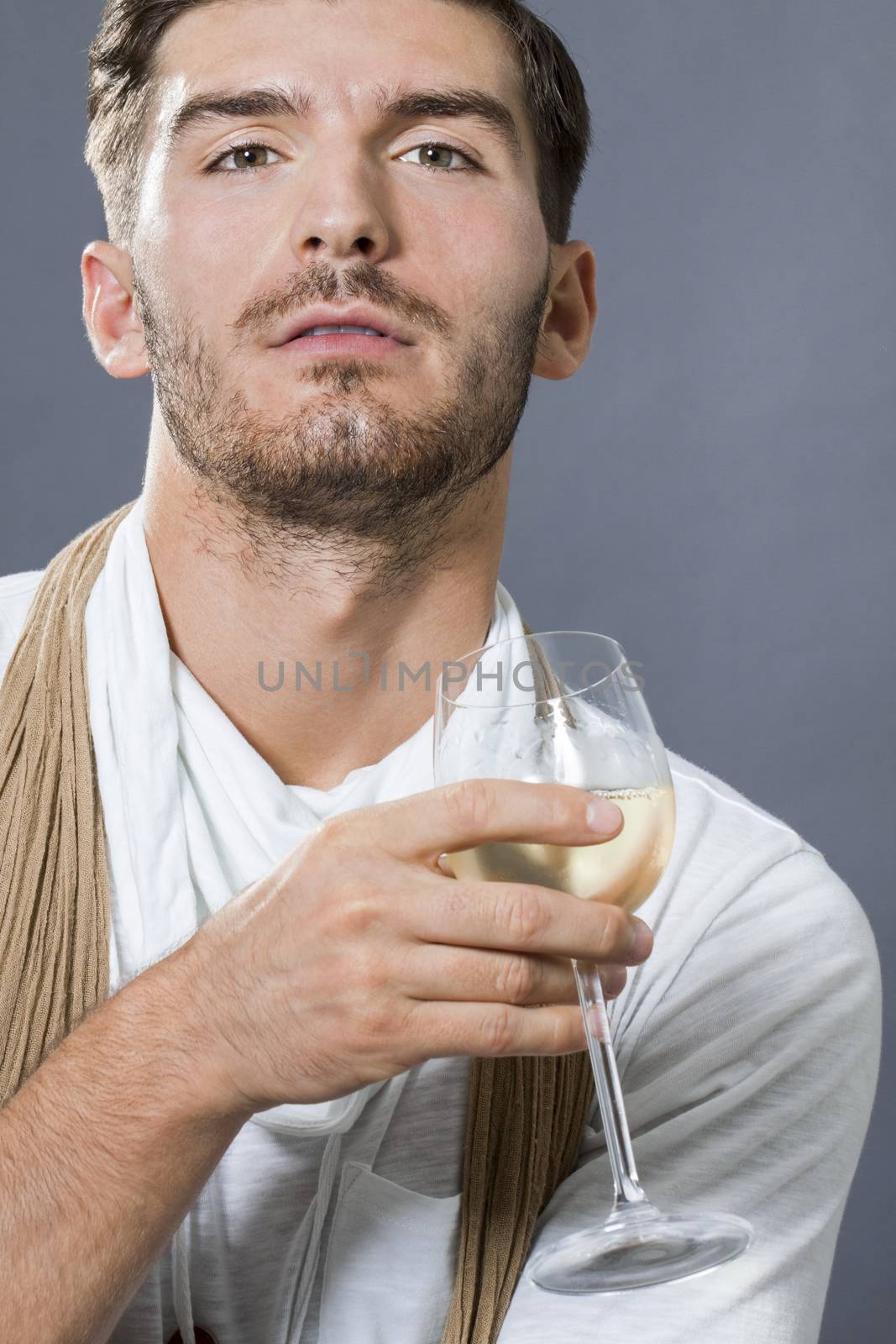 Sexy handsome man drinking white wine by juniart