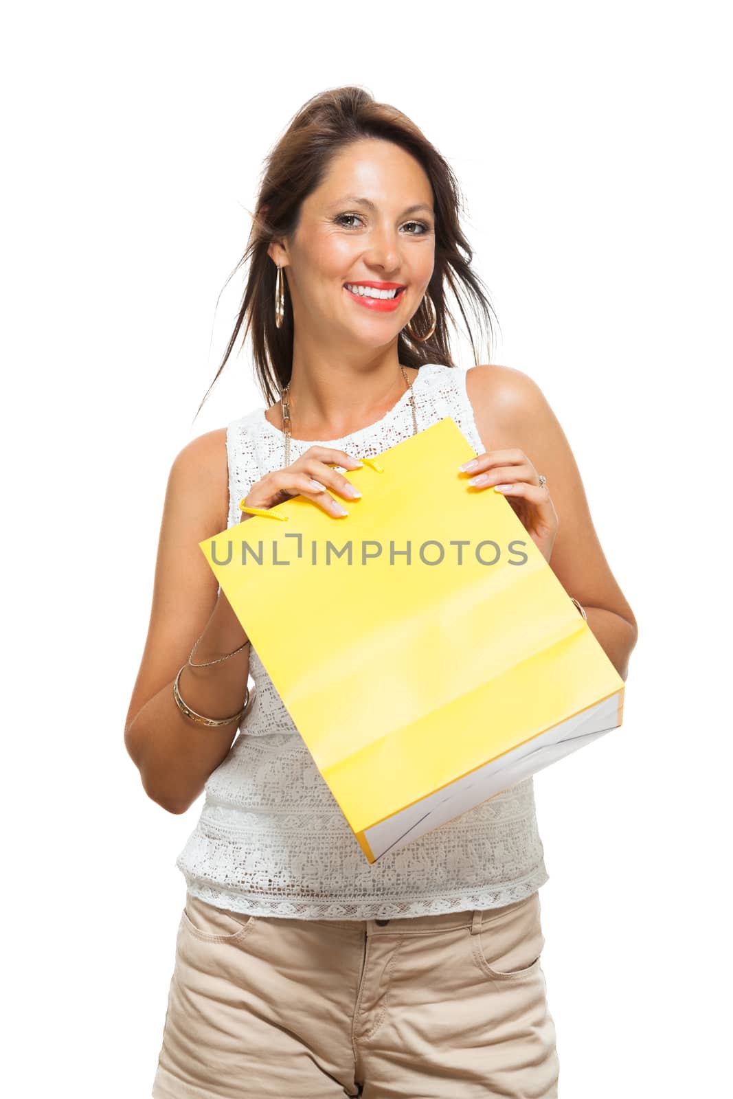 Very Happy Stylish Woman Raising Three Colored Shopping Paper Bag with Mouth Open and Looking at the Camera. Isolated on White Background.