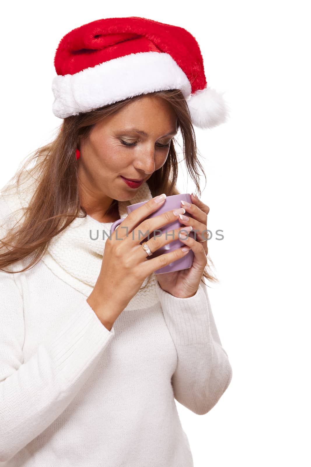 Cold young woman in a Santa hat sipping coffee tea by juniart