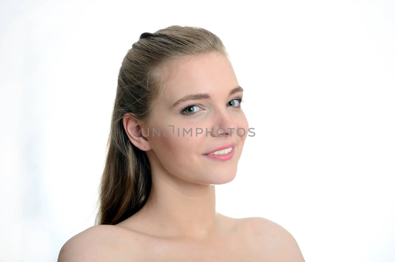 Pretty Polish model with gentle smile. Portrait of charming young girl with white background.