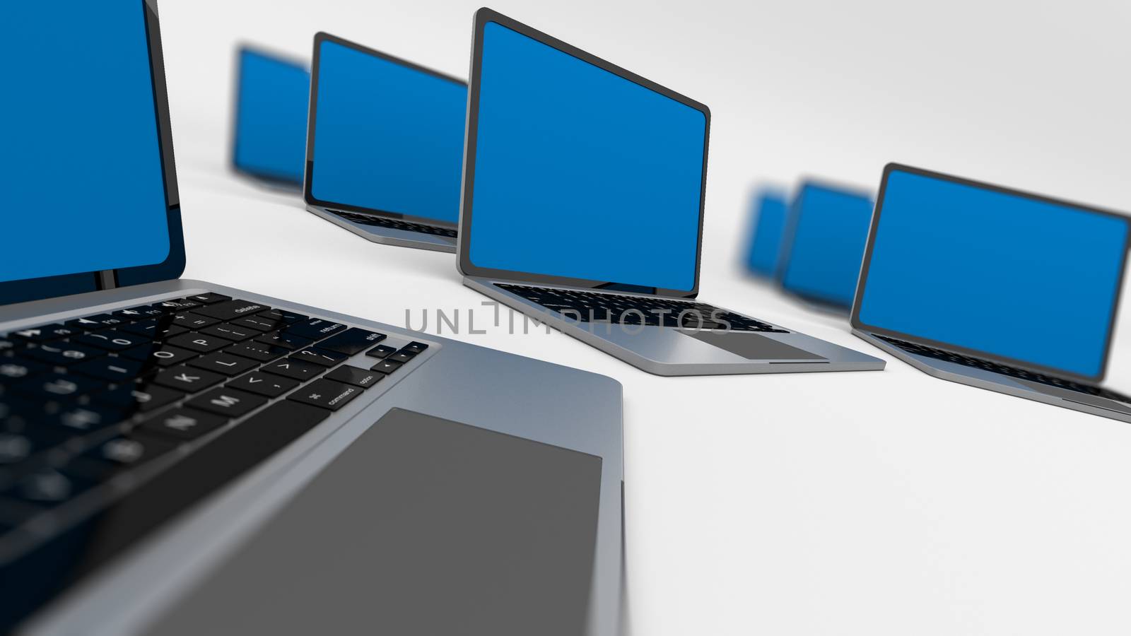 Many laptops in a circle isolated on white. Shallow depth of field.