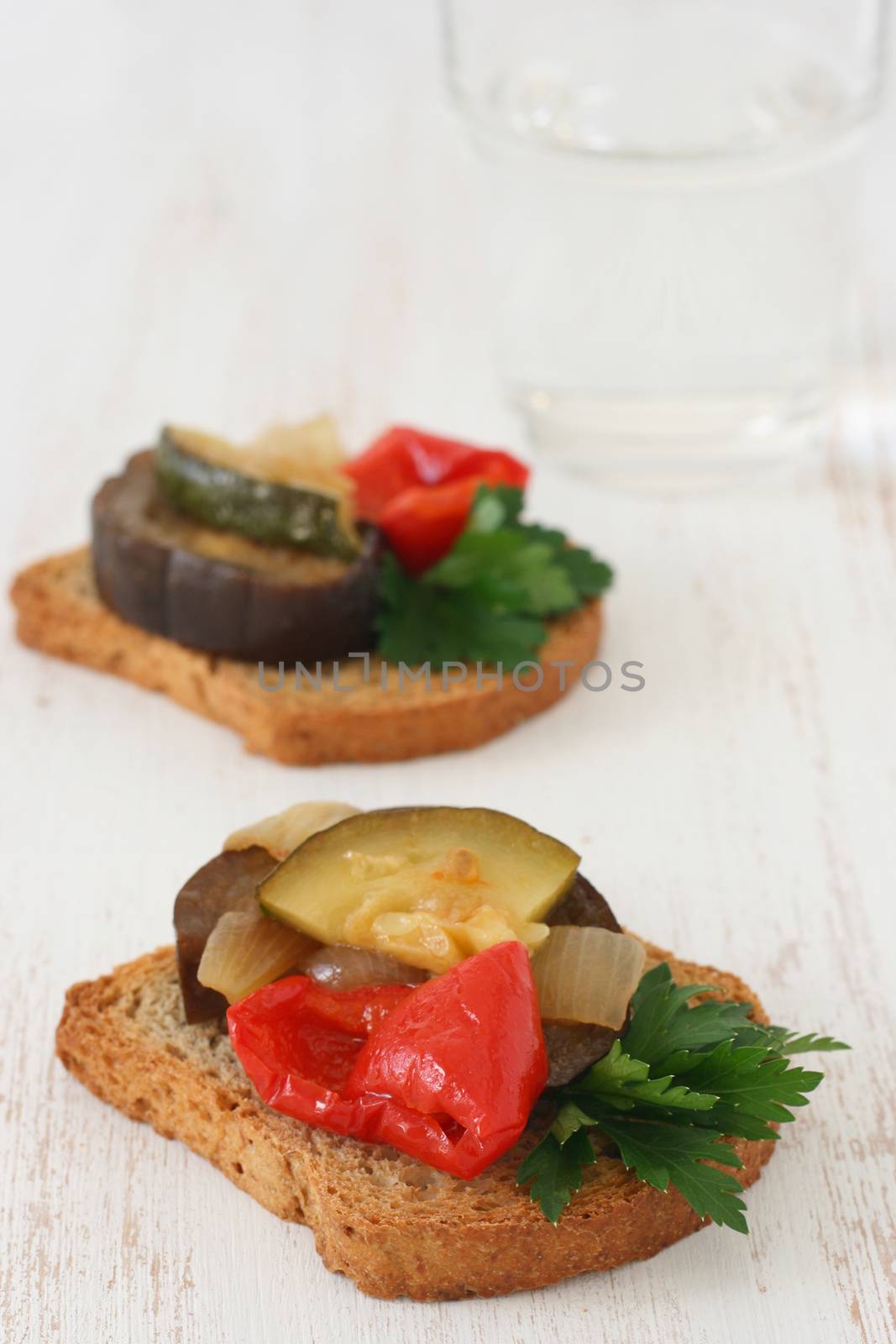 toasts with vegetables on plate