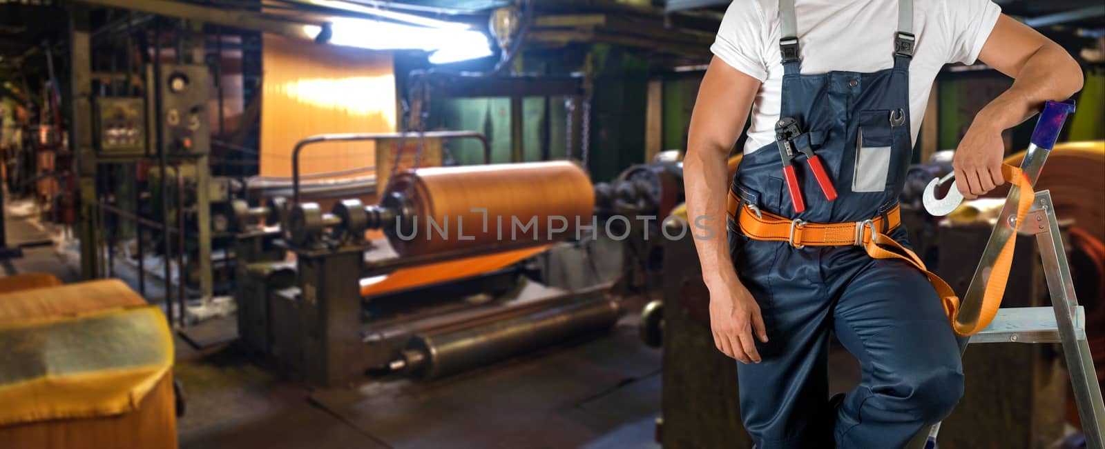 Worker with instruments at industrial factory