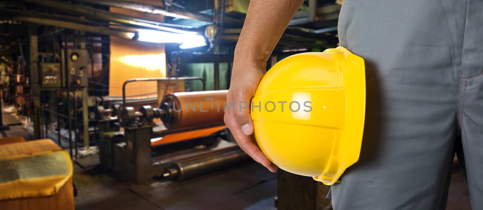 Worker with safety helmet at industrial factory