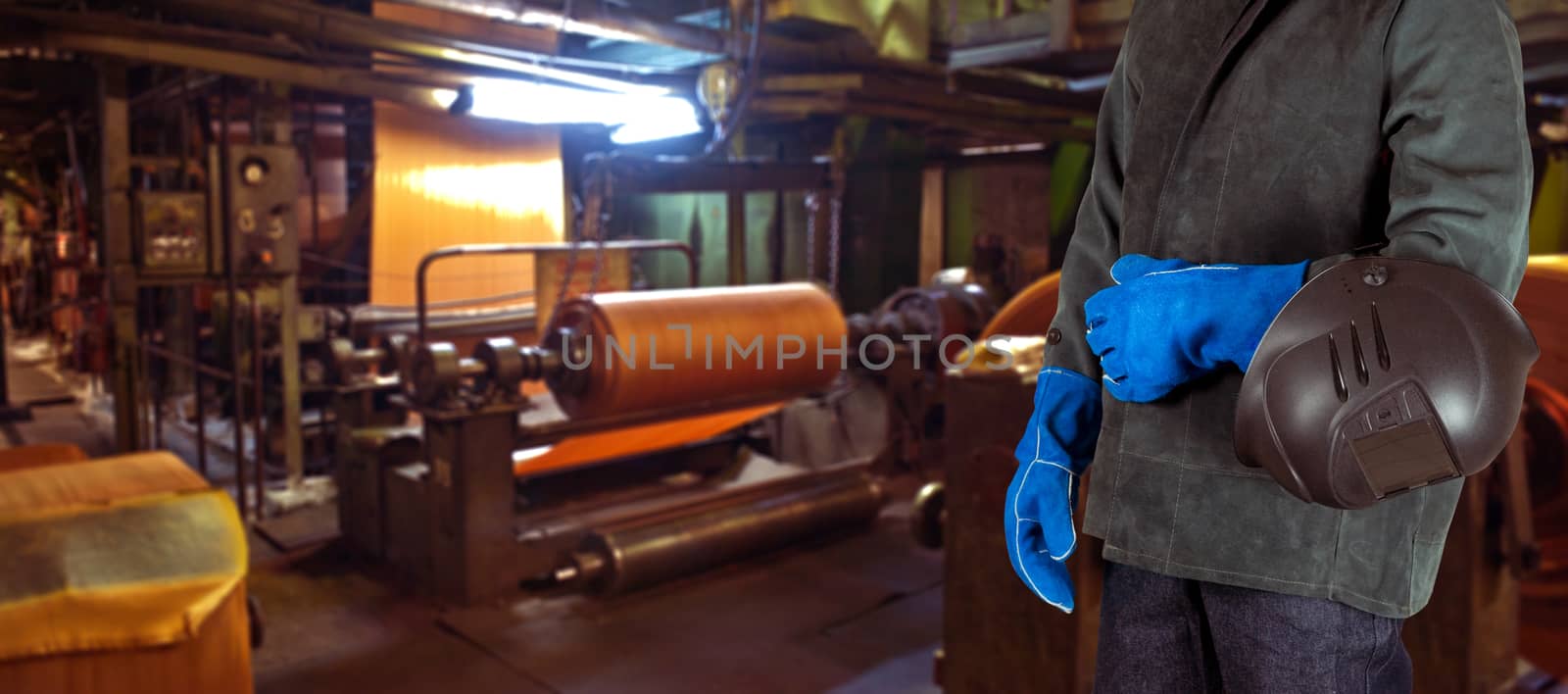 Worker with instruments at industrial factory