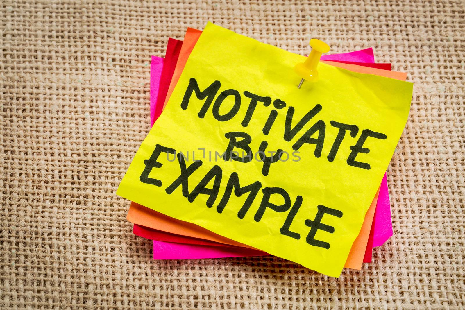 motivate by example - advice or reminder on a yellow sticky note