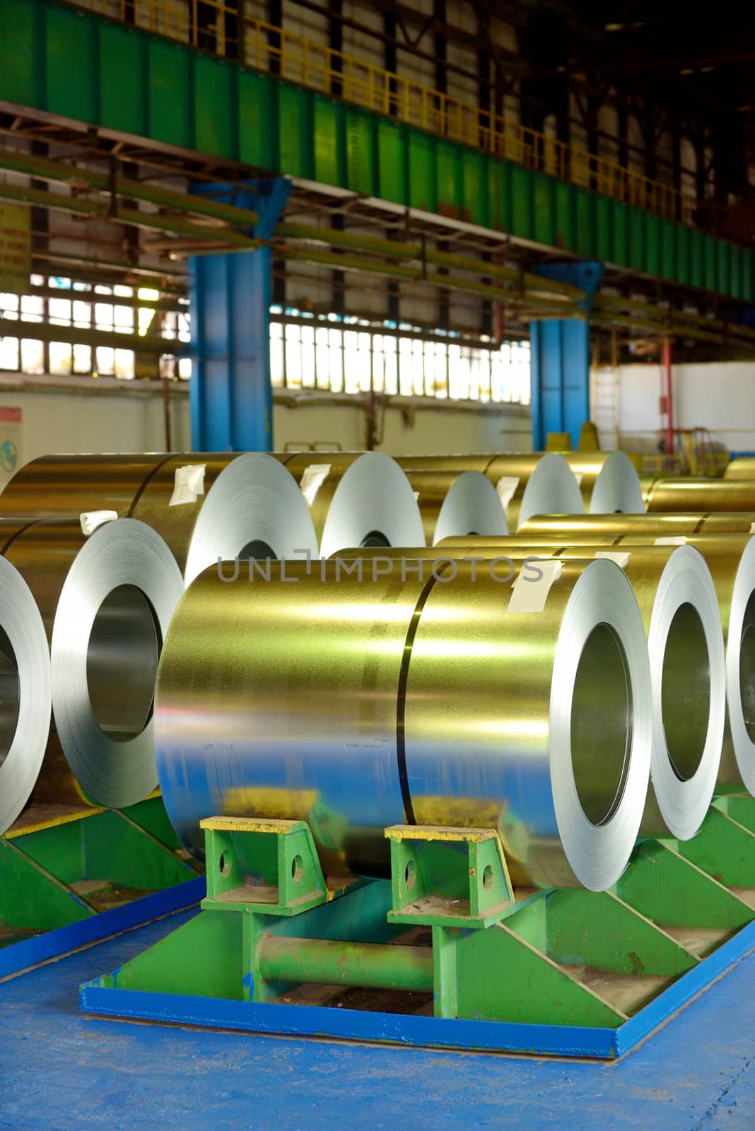 rolls of steel plate stored in warehouse