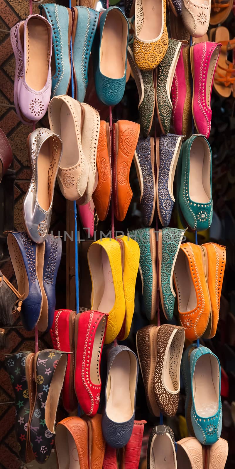 Moroccan colourful leather shoes on display by Brigida_Soriano